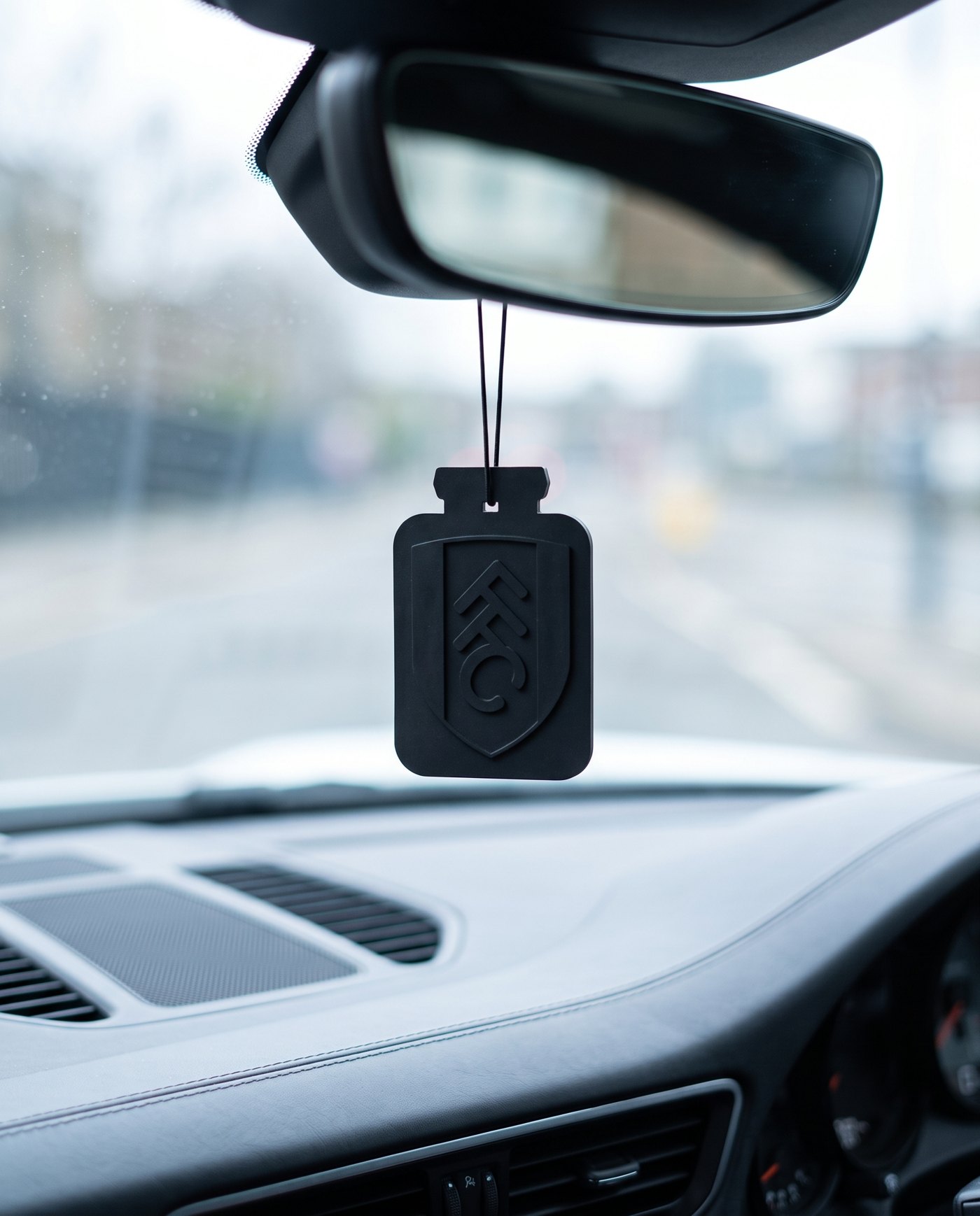 Fulham FC card hanging in the car